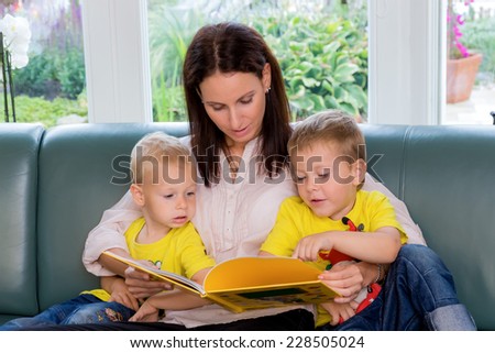 a mother is reading to your children a fairy tale from a book before