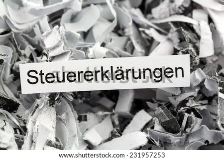 tagged with shredded paper tax returns, symbolic photo for tax burden and obligation to preserve