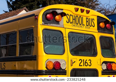 a typical american school bus in yellow color