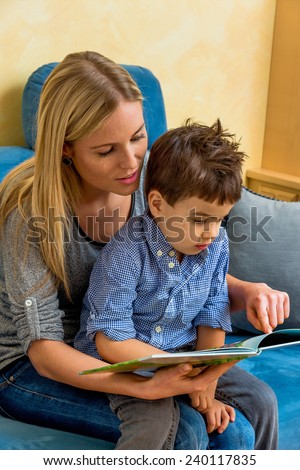 mother and son reading a book, symbol of maternal love, happiness, family, learning
