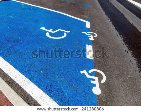 parking for wheelchair users. disabled parking in a city.