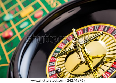 the cylinder of a roulette gambling in a casino. winning or losing is decided by chance.
