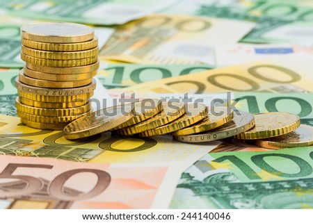 single stack coins, coins lying, symbolic photo for capital investment, risk and profit drop