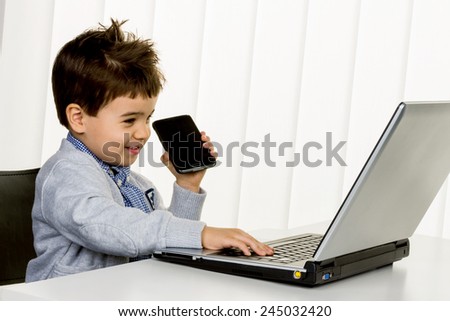 little boy on a laptop, symbol of the internet, e-commerce, consumer behavior