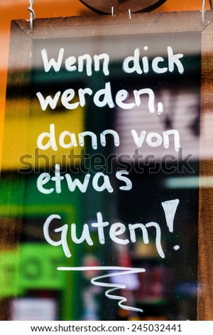 switzerland, zurich, sign slogan to get fat in a consumer society