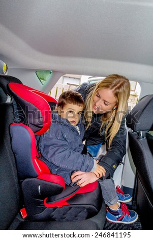 boy in a car seat, symbol of protection, care, vehicle safety