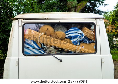 belongings in a van, symbolic photo for relocation and holidays