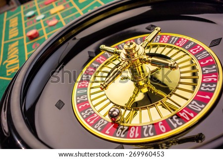 the cylinder of a roulette gambling in a casino. winning or losing is decided by chance.