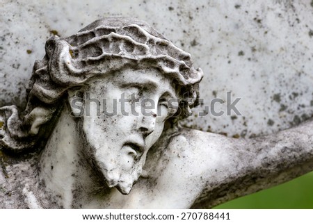 crucifixion of jesus on a grave stone in the cemetery barbara in linz, austria, suffering and death