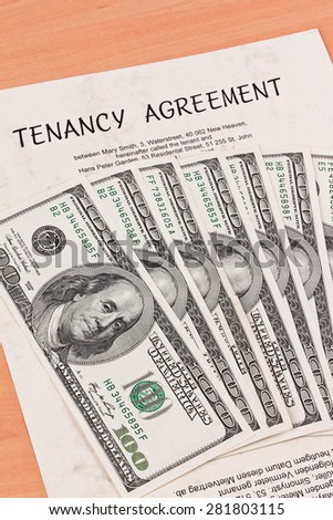 dollar bills and rental agreement in english