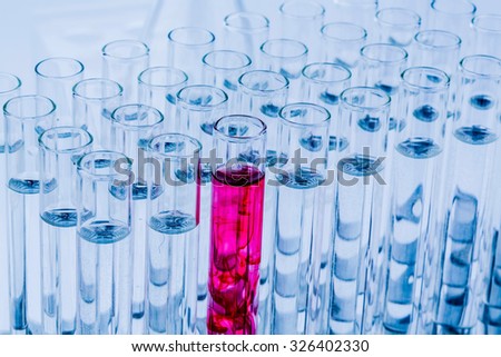 many test tubes in an attempt at a research laboratory of a university. learning and research symbolfoto for.