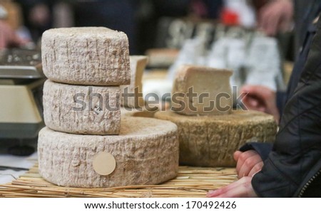 Pile of artisan cheese at festival