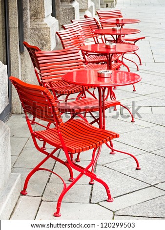 tables and chairs at a sidewalk cafe in rome - italy