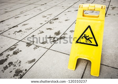 caution wet floor sign at a corridor in vienna
