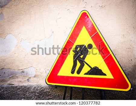 men at work sign at a road construction site in italy