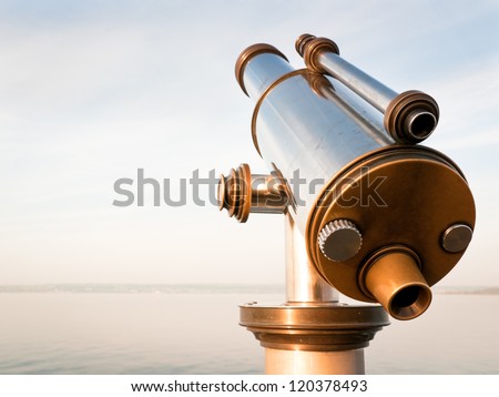 coin-operated binoculars at a lake