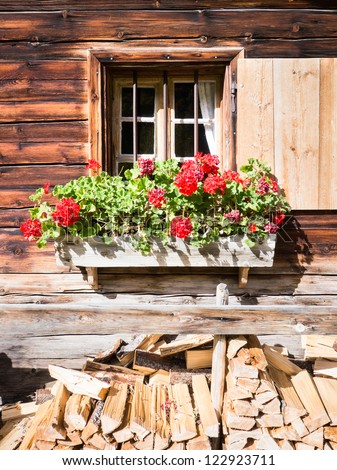 typical bavarian window at an old log cabin