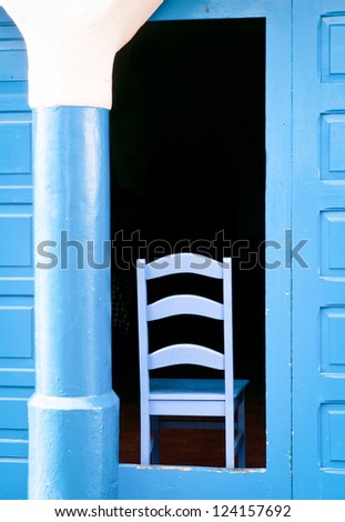 blue chair at a door