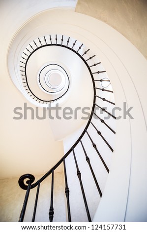 beautiful spiral staircase at a villa