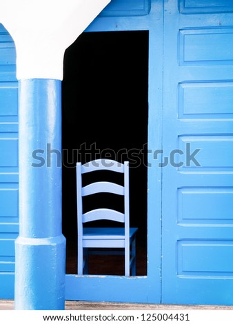blue chair at a door