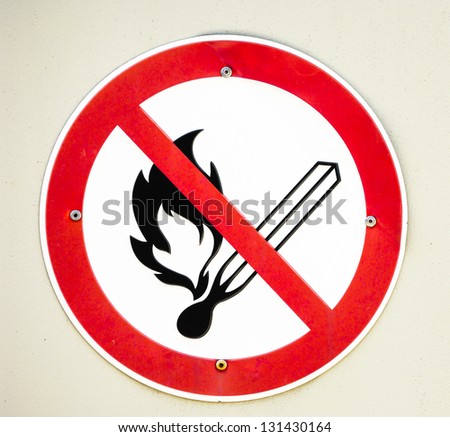 no open fire-sign in front of gray wall