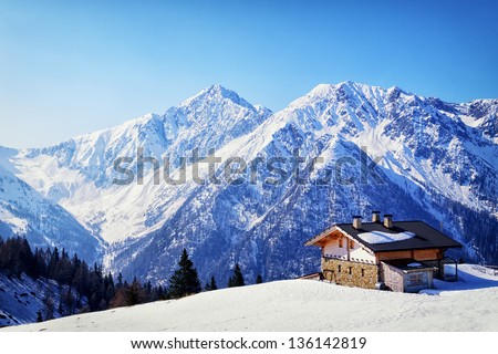 old house at the european alps in winter