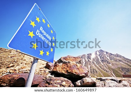 border at the european alps and the sign for the republic austria