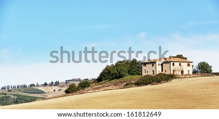 typical old farmhouse at the tuscany in italy