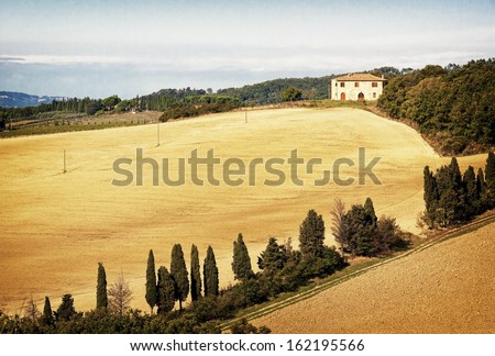 typical old farmhouse at the tuscany in italy