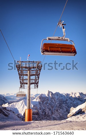 mountains with modern ski lift chair
