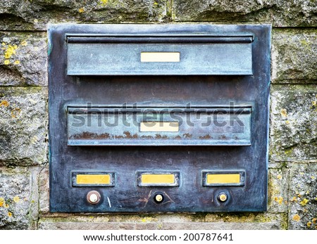 old mail slot at a door