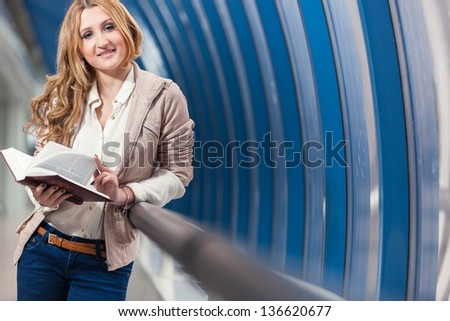 girl with book/ girl holding red book