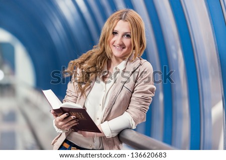 girl with book/ girl holding red book