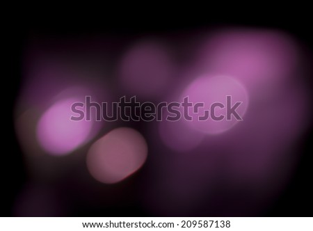 light bokeh at night in purple and black background