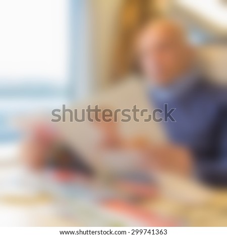 blur traveler sitting and reading in high speed train