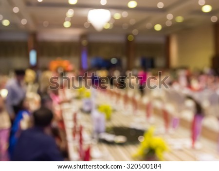 blur formal dining table in grand hall of hotel