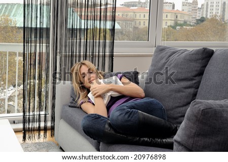 A woman who fell asleep on her couch while reading
