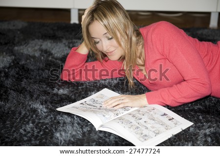 woman reading comics on her flat