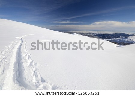 Back country skiing in scenic high mountain landscape and superb view.