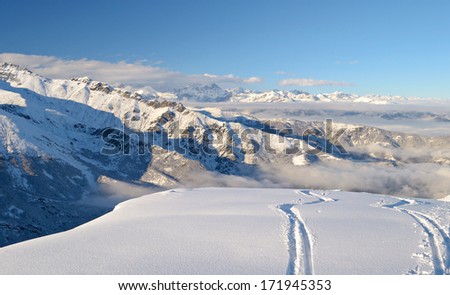 Ski touring tracks (back country ski tracks) in majestic high mountain scenery, italian Alps