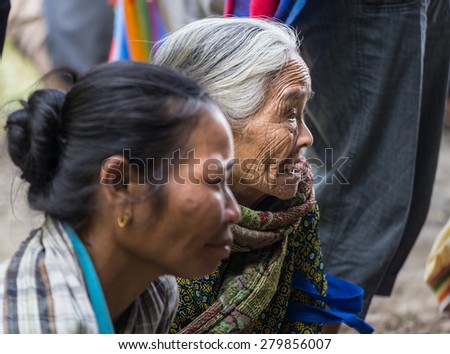 Lokomata, Indonesia - September 9, 2014: Portrait of a senior woman of Toraja ethnicity in Lokomata, Tana Toraja, Sulawesi, Indonesia. Selective focus.