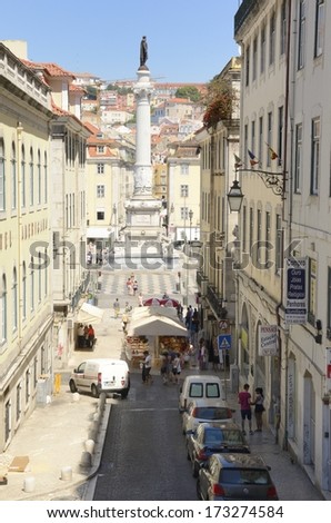 LISBON, PORTUGAL - AUGUST 11: Street on August 11, 2013 in Lisbon, Portugal.  Lively Street leading to the Restauradores Square in Liboa, Portugal.