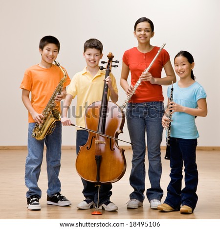 Confident musicians holding saxophone, cello, flute and clarinet