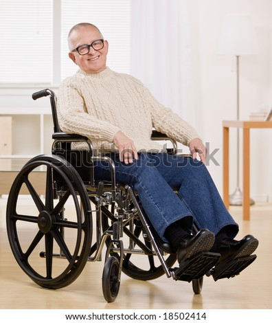 Happy disabled man in wheelchair