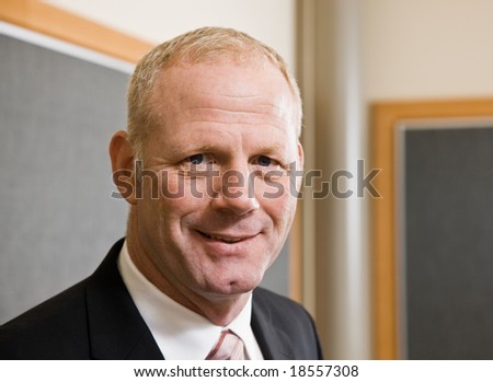 Close up of mature businessman in suit and tie