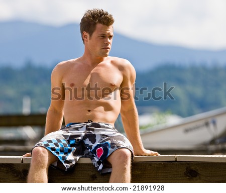 Man sitting on pier