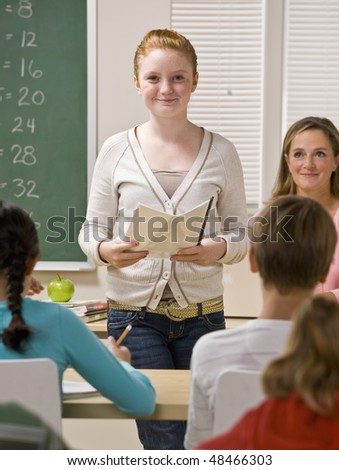 Student giving report in classroom