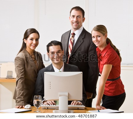 Business people looking at computer