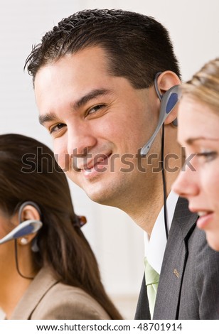 Business people talking on headsets