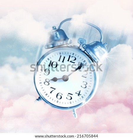 Alarm clocks flying on blue sky, time flies concept.